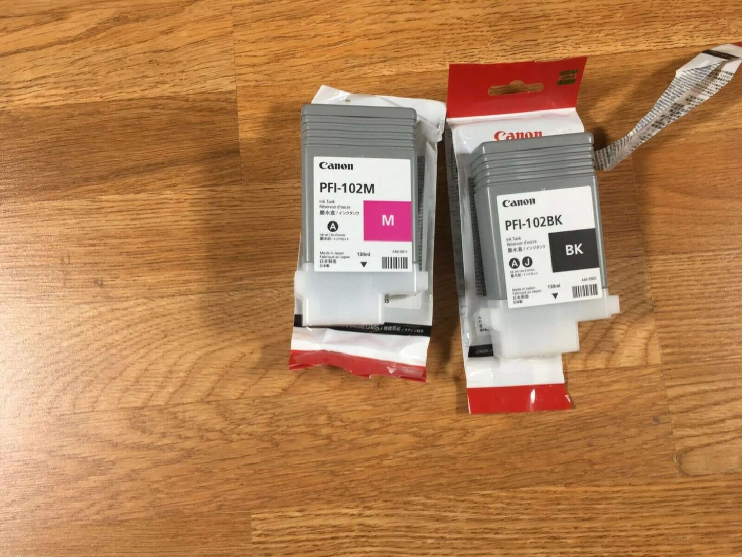 Lot of 2 Barely Used - OEM Canon PFI-102BK PFI-102M - copier-clearance-center
